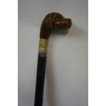 Ebonised Sword Stick, Having a carved dog head pommel / handle, blade 59.5cm long, handle a/f