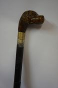 Ebonised Sword Stick, Having a carved dog head pommel / handle, blade 59.5cm long, handle a/f