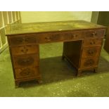 Mahogany Kneehole Desk, Having a tooled leather skiver above a central drawer, flanked with four