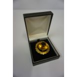 18ct Gold Citrine Brooch, the large citrine measuring approximately 2.5cm diameter, in a claw