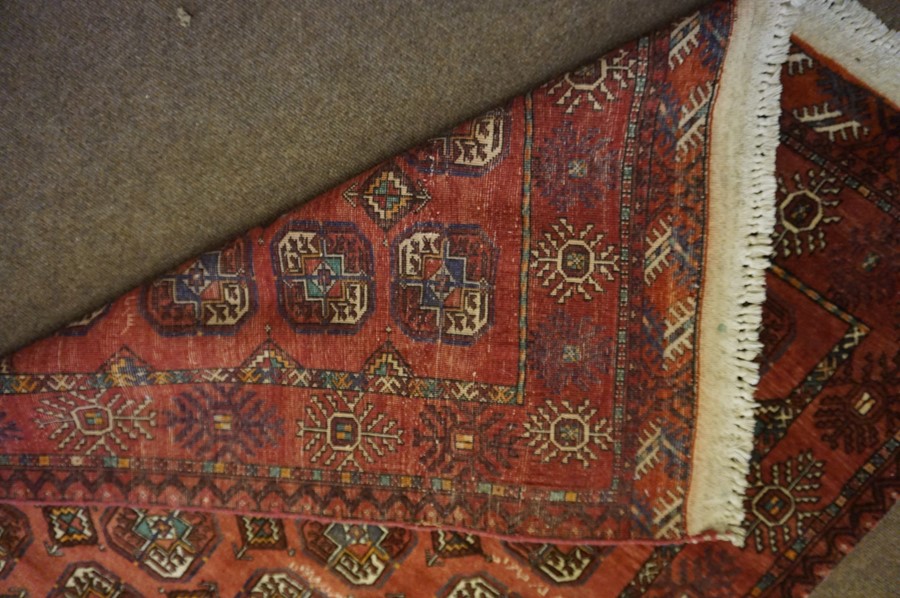 Turkman Rug, Decorated with allover rows of geometric motifs on a red ground, 212cm x 125cm - Image 3 of 3