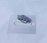 18ct Gold and Diamond Five Stone Crossover Ring, ring size M, overall weight 3.7 grams