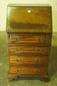 Ladies Mahogany Writing Bureau, Having a fall front above four drawers, 102cm high, 55cm wide,