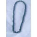Jade Bead Necklace, with a gold catch, inset with a jade cabochon, approximately 24cm long