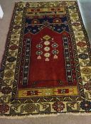 Yahyali Rug, Decorated with floral and geometric medallions on a red and beige ground, 180cm x