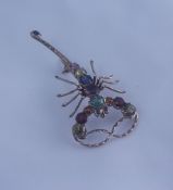 9ct Gold Gem Set Scorpion Brooch, Set with rubies, sapphires, peridot and topaz stones, stamped