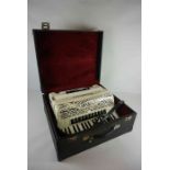 Piano Accordion by E Soprani, Decorated in faux mother of pearl, with case