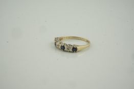 9ct Gold Sapphire and Diamond Ring, set with four small sapphires, interspersed with three small