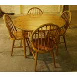 Pine Circular Table, 76cm high, 117cm wide, with four pine spindle back chairs, 93cm high, (5)