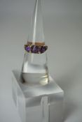 18ct Gold Amethyst Ring, Set with three graduated amethyst,s, stamped 18, overall 5.2 grams, ring