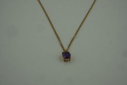 Amethyst Pendant, set in an unmarked yellow metal mount, on a 9ct gold chain, stamped 375 to