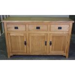 Modern Oak Sideboard, Having three small drawers above three cupboard doors, 83cm high, 138cm