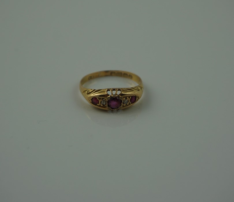 18ct Gold Ruby and Diamond Ring, Set with a ruby to the centre, flanked with smaller rubies and - Image 2 of 7