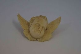 Victorian Relief Carved Ivory Cherub Brooch, 6cm diameter, later clasp to reverse