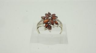 9K White Gold Gem Set Cluster Ring, Set with ruby style stones, flanked with diamond chips to the