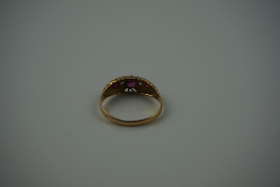 18ct Gold Ruby and Diamond Ring, Set with a ruby to the centre, flanked with smaller rubies and - Image 5 of 7