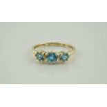 9ct Gold Gem Set Three Stone Ring, set with three aquamarine coloured stones, stamped 375, overall