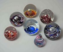 Seven Assorted Selkirk Glass Paperweights, (7)Condition reportMinor scratches to paperweights.  No