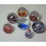 Seven Assorted Selkirk Glass Paperweights, (7)Condition reportMinor scratches to paperweights.  No