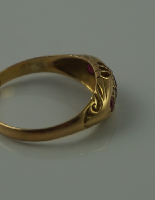 18ct Gold Ruby and Diamond Ring, Set with a ruby to the centre, flanked with smaller rubies and - Image 7 of 7