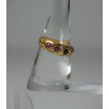 18ct Gold Ruby and Diamond Ring, Set with three small rubies, interspersed with two small