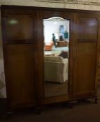 Mahogany Wardrobe, Having a central mirrored section, flanked with a door, raised on cabriole