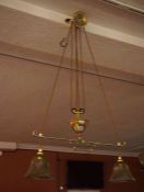 Brass Rise and Fall Ceiling Light, circa early 20th century, Having a pully mechanism, with two