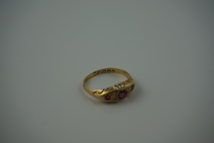 18ct Gold Ruby and Diamond Ring, Set with a ruby to the centre, flanked with smaller rubies and - Image 3 of 7