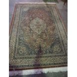 Persian Style Machine Made Rug, Decorated with floral panels on a red ground, 255cm x 165cm