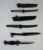 Two Japanese Daggers, Blades 16cm long, stamped Japan, having metal handles, with black leather