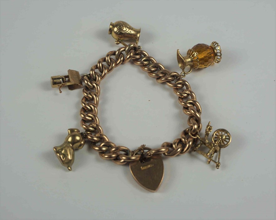 9ct Gold Padlock Bracelet, With five assorted attached charms, stamped 9ct to padlock and links,