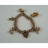 9ct Gold Padlock Bracelet, With five assorted attached charms, stamped 9ct to padlock and links,