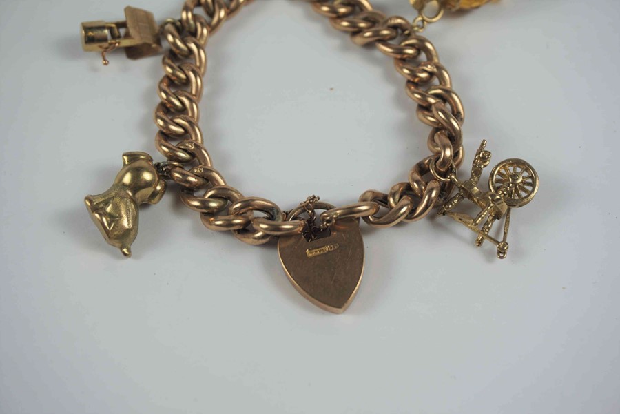 9ct Gold Padlock Bracelet, With five assorted attached charms, stamped 9ct to padlock and links, - Image 2 of 4