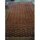 Turkoman Carpet, Decorated with multiple geometric motifs on a red ground, 340cm x 267cmCondition