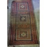 Persian Bluch Rug, Having geometric decoration on a red ground, 190cm x 95cm