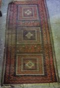 Persian Bluch Rug, Having geometric decoration on a red ground, 190cm x 95cm