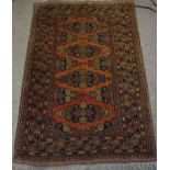 Afghan Rug, Decorated with geometric motifs on a rust ground, 120cm x 80cm