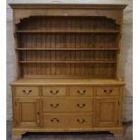 Pine Dresser, Having open shelving above four small drawers and two long drawers, flanked with a