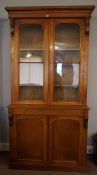 Victorian Oak Two Door Library Bookcase, Having two glazed doors to the top section, enclosing a