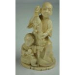 Japanese Ivory Figure Group, Meiji period, pre 1947, Modelled as a buddha with child, raised on a