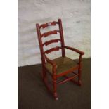 Childs Red Painted Rocking Chair, Having a woven seat, 79cm high