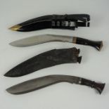 Two Kukri Daggers, One having wood grip with two small knifes, the other having an ebonised grip