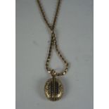 Yellow Metal Enamel Locket, Possibly unmarked gold, 2cm, on a 9ct gold chain, stamped 9ct, gross