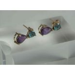 A Pair of Gem Set Earrings, The stones set in Amethyst and Aquamarine colours, on a yellow metal