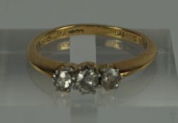 18ct Gold Diamond Three Stone Ring, Stamped 18ct, gross weight 3.3 grams