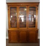 Victorian Oak Three Door Library Bookcase, Having three glazed doors to the top section, enclosing a