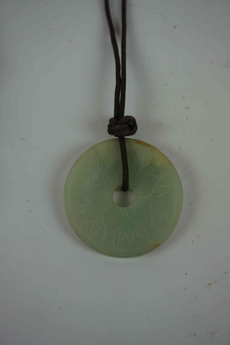 Chinese Carved Jade Pendant, Modelled as a dragon, 5cm high, also with two similar disc pendants, - Image 5 of 5