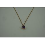 Amethyst Pendant, set in an unmarked yellow metal mount, on a 9ct gold chain, stamped 375 to
