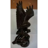 Large Carved Figure of an Eagle, raised on a naturalistic stump, 101cm high