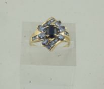 9ct Gold Gem Set Cluster Ring, set with a central sapphire style stone, flanked with allover